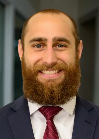 Adam Yascavage office bkg 500x700